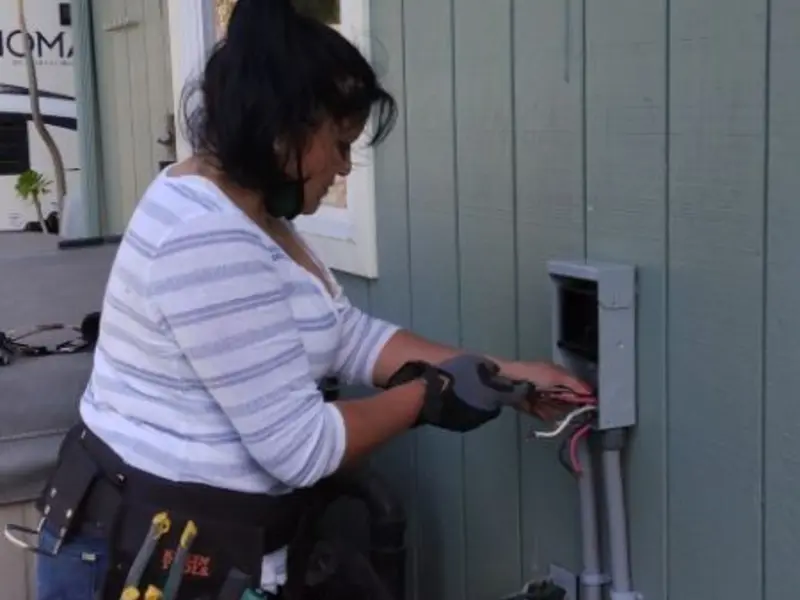 Licensed electrician wiring an exterior subpanel in Rush City